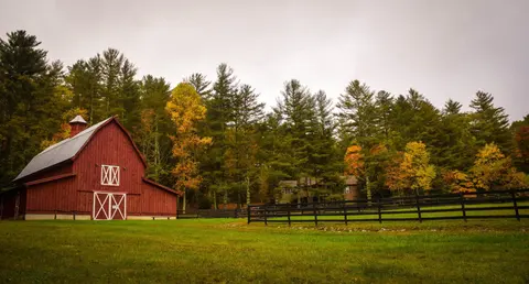 beautiful-red-barn-next-to-black-fence-and-trees-background-wallpaper-pictures-_16A5
